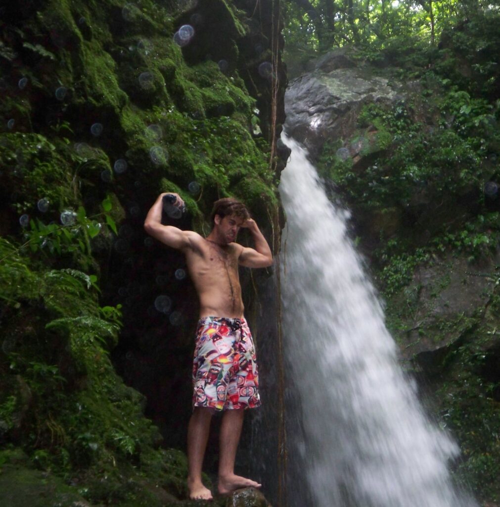 Flexing At Mossy Waterfall in Costa Rica