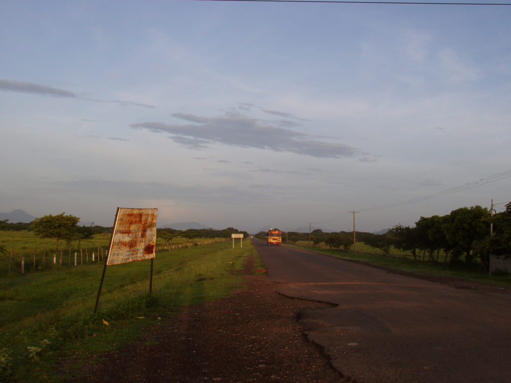 Bus Driving Off - Nicaraguan Highway in Countryside